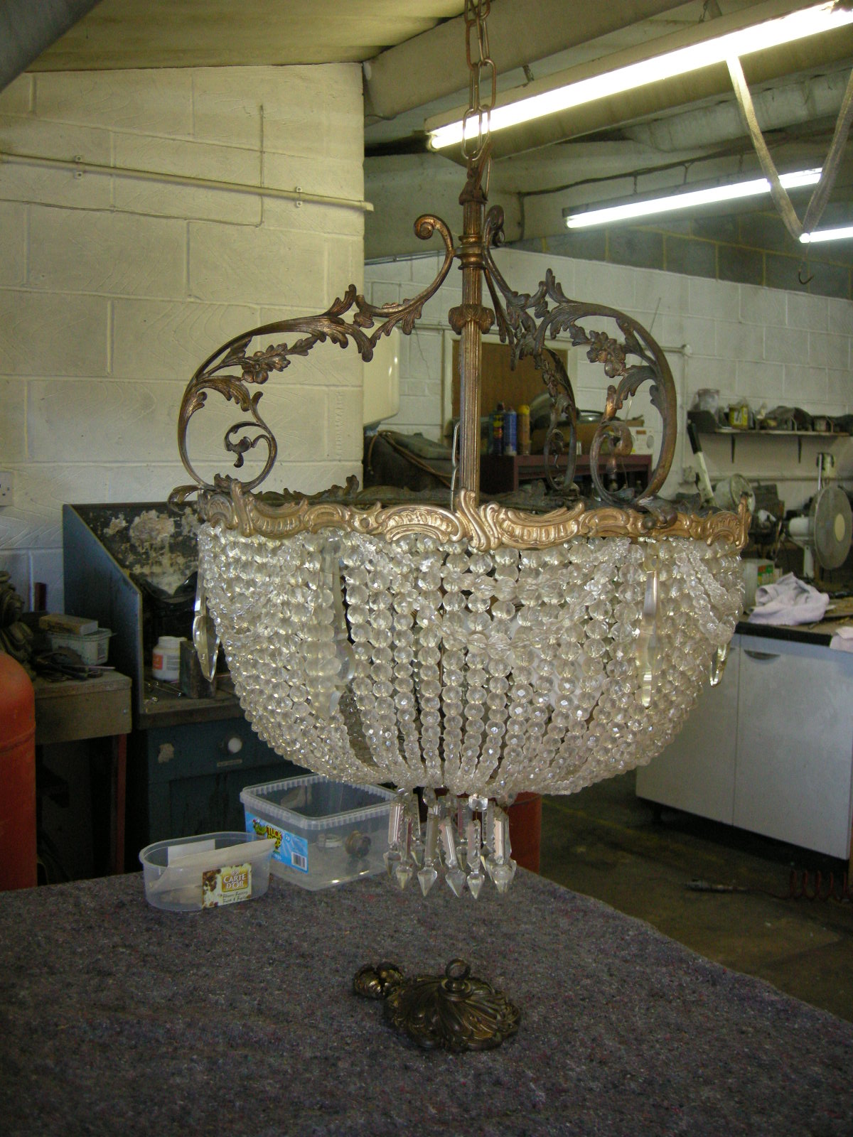 brass and glass chandelier before restoration